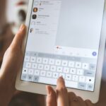 person using white iPad